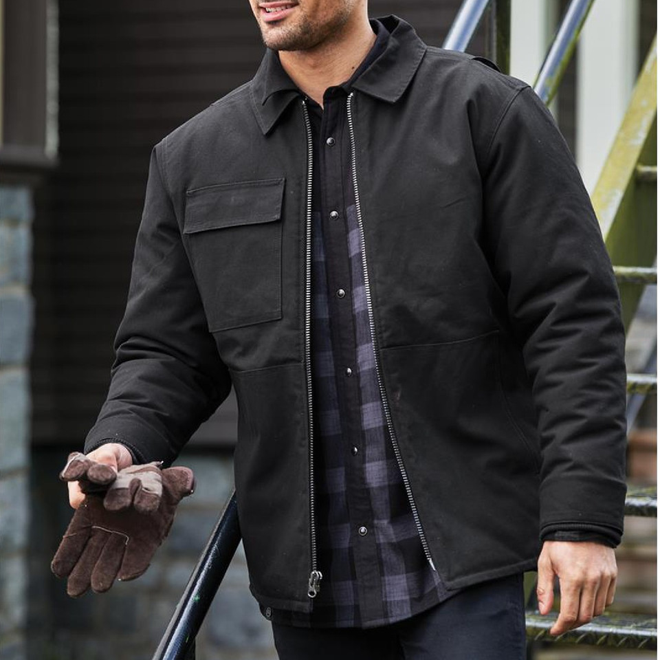 Man wearing black insulated work jacket with zip front, shirt collar, and chest pocket