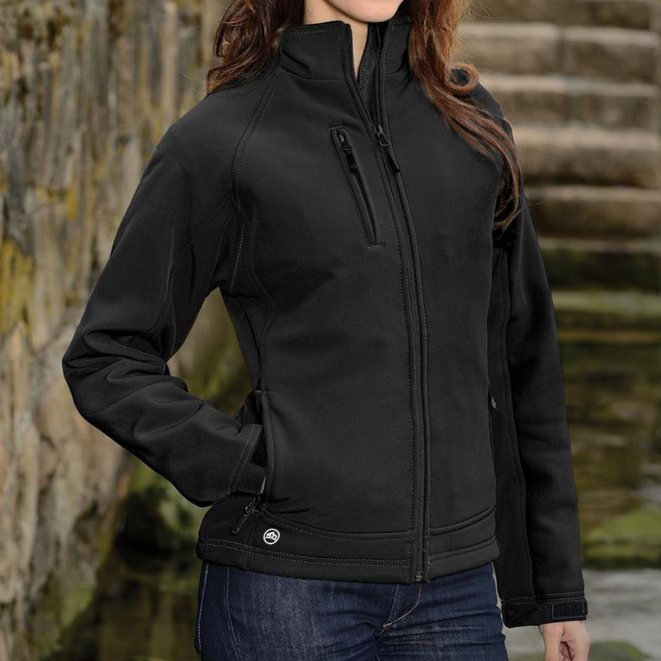 Woman wearing black bonded softshell jacket with stand collar, full-zip front, and chest zip pocket