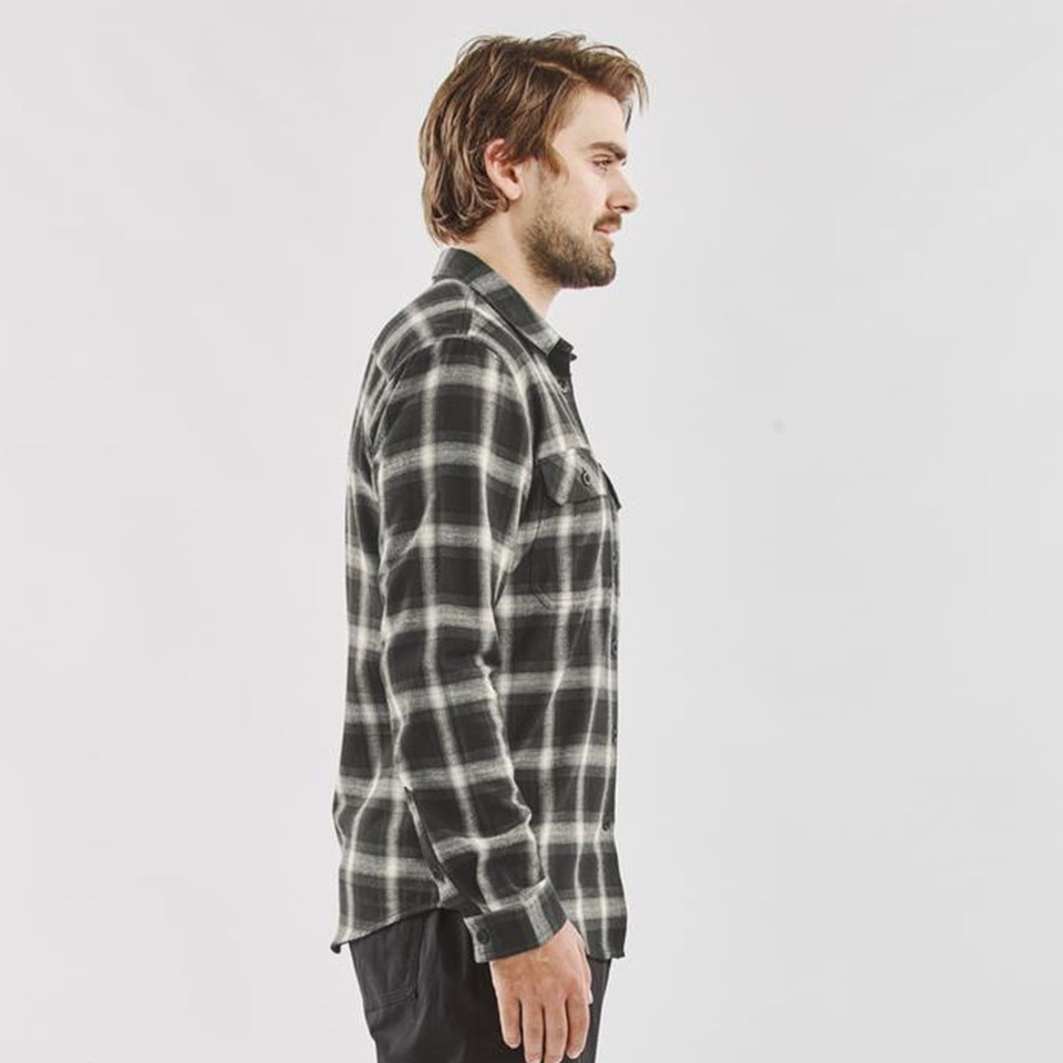 Man wearing a charcoal and cream plaid long sleeve flannel shirt with chest pocket, side profile view