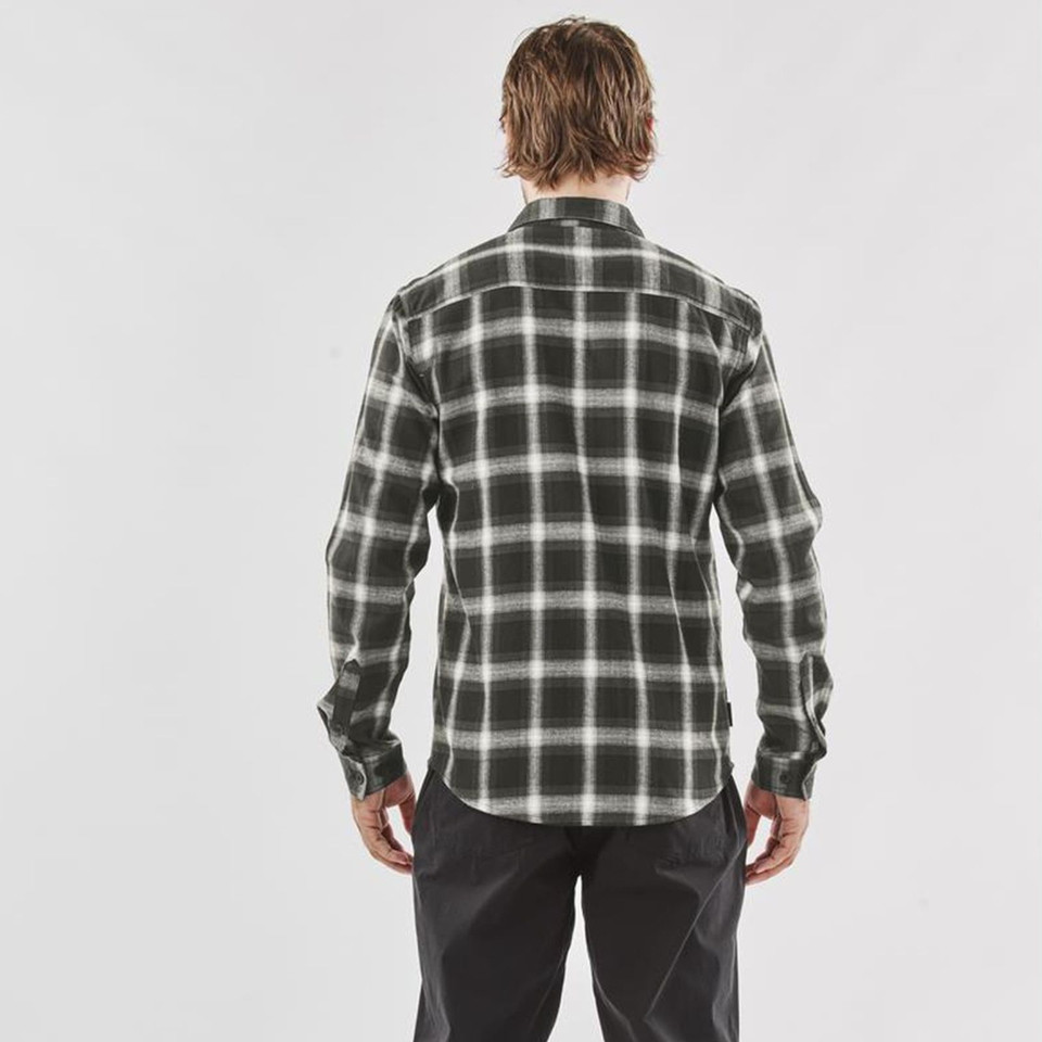 Man wearing olive and cream plaid flannel long sleeve shirt, rear view, curved hem, relaxed fit