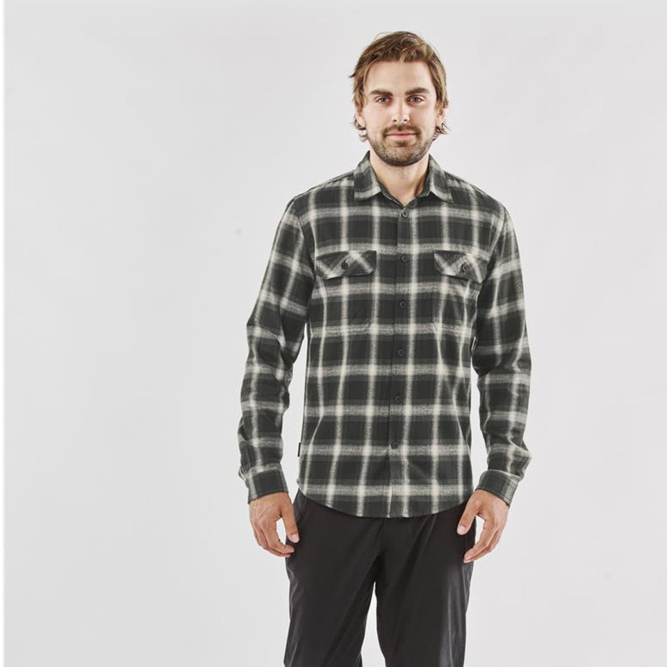 Man wearing charcoal and cream plaid long sleeve flannel shirt with dual chest pockets
