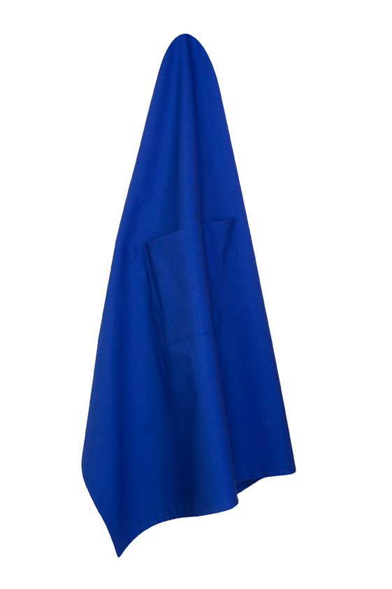 Royal blue short waist canvas apron hanging with tie visible at top