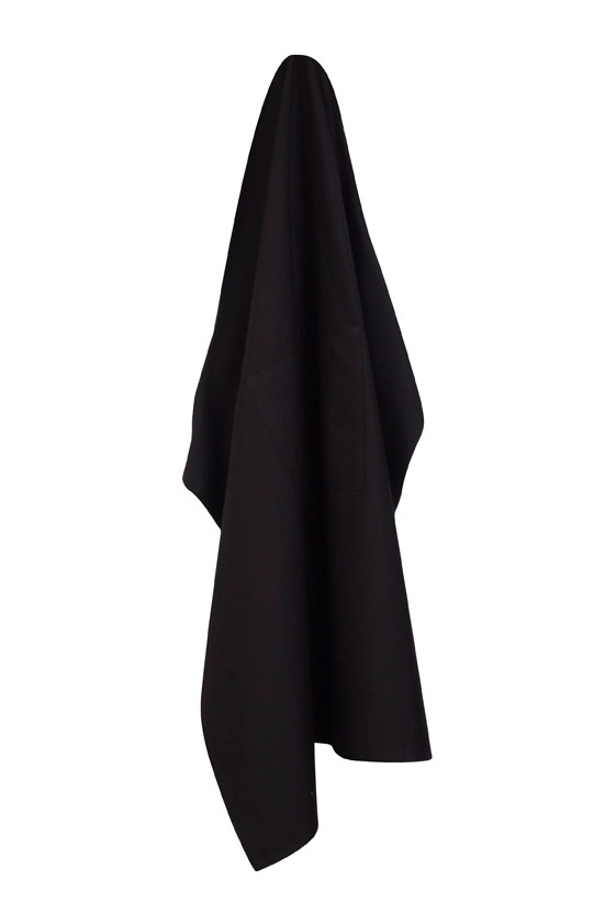 Black canvas short waist apron hanging with flat front panel and side ties visible