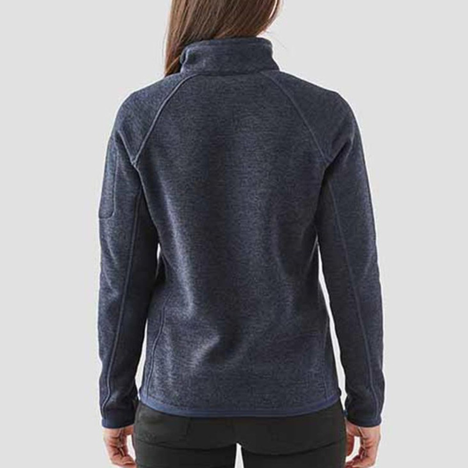 Rear view of woman wearing navy marl recycled fleece quarter-zip pullover with raglan sleeves and contrast side panels
