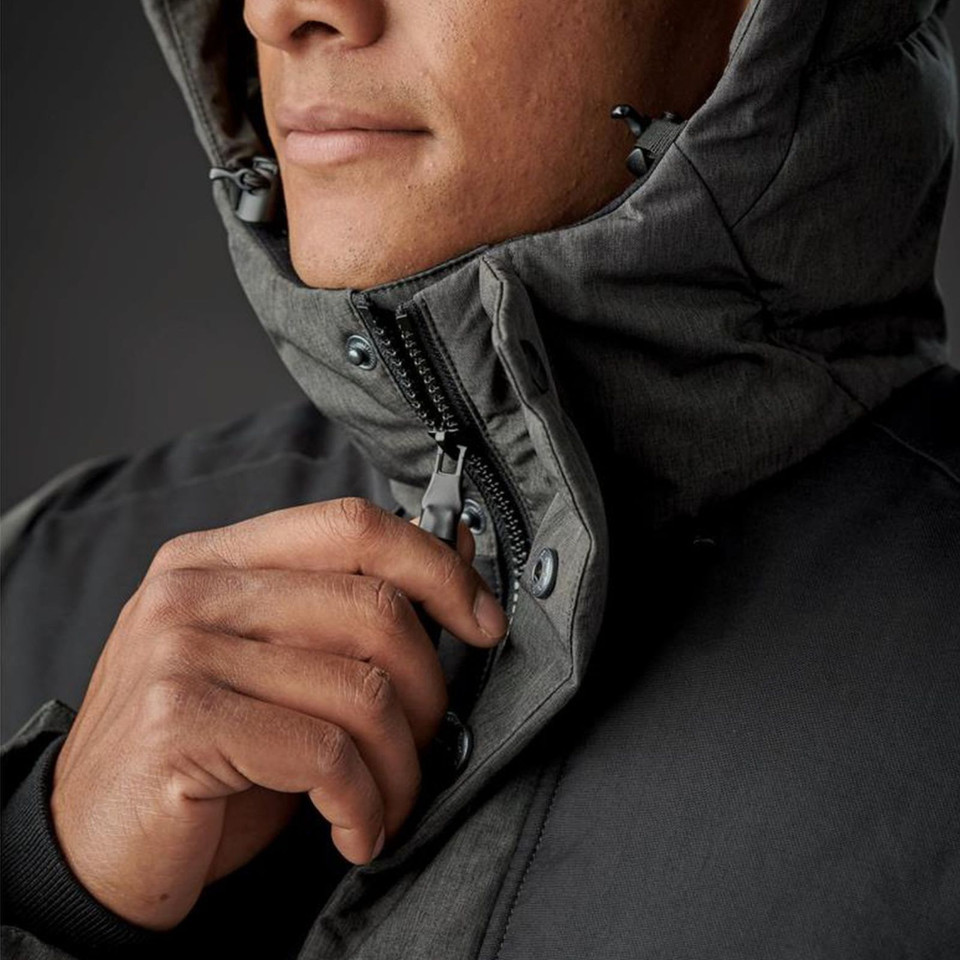 Close-up of charcoal insulated parka hood with contrast zip placket, snap buttons and panelled construction on male model