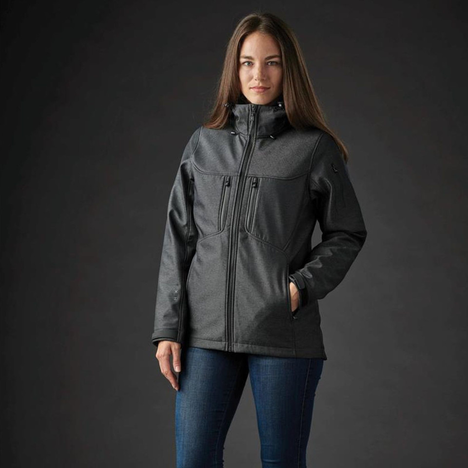 Woman wearing charcoal marl 3-in-1 softshell system jacket with hood, chest zip pocket and tonal zip detailing