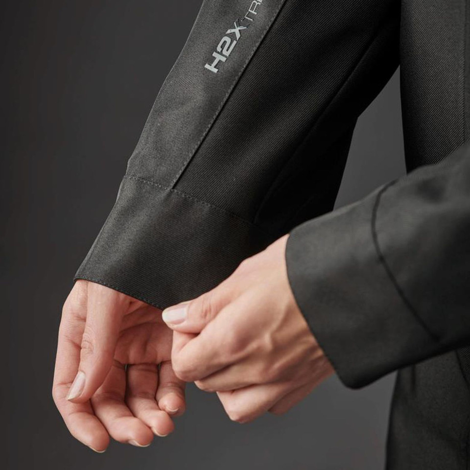 Close-up of charcoal Stormtech jacket sleeve cuff with panelled construction and H2X reflective branding detail