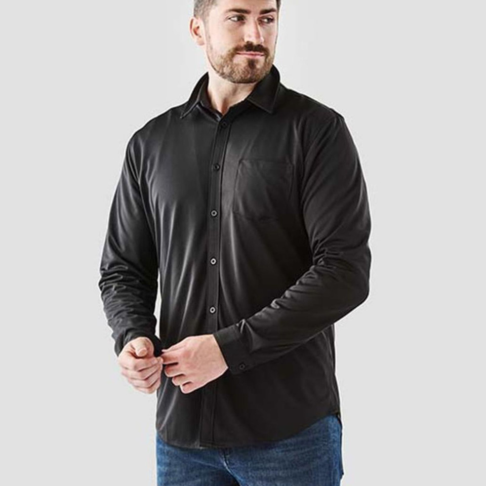 Man wearing black long sleeve performance shirt with button placket, point collar and chest pocket