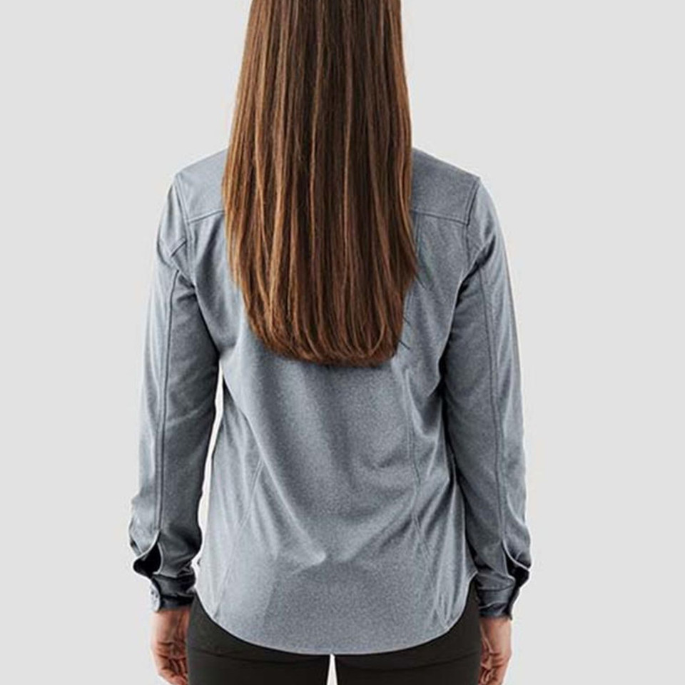 Rear view of woman wearing a slate grey long sleeve performance shirt with shoulder seam detailing and cuffed wrists