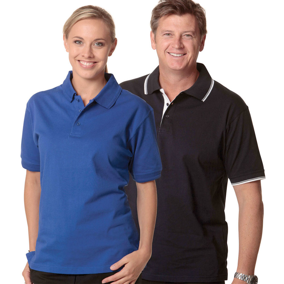 Man and woman wearing short-sleeve polo shirts in royal blue and navy with white contrast tipping on collar and cuffs