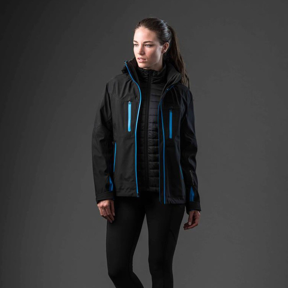 Woman wearing black 3-in-1 system jacket with electric blue zip trim, quilted inner vest and softshell outer layer