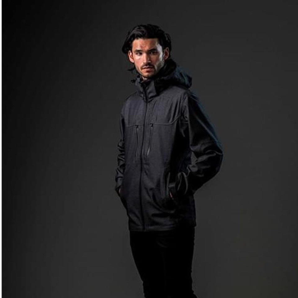 Man wearing charcoal heathered softshell jacket with attached hood, centre zip, chest pocket and side hand pockets