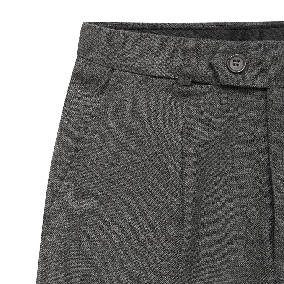 Charcoal grey kids formal trousers detail showing belt loops, button tab waistband and pleated front panel