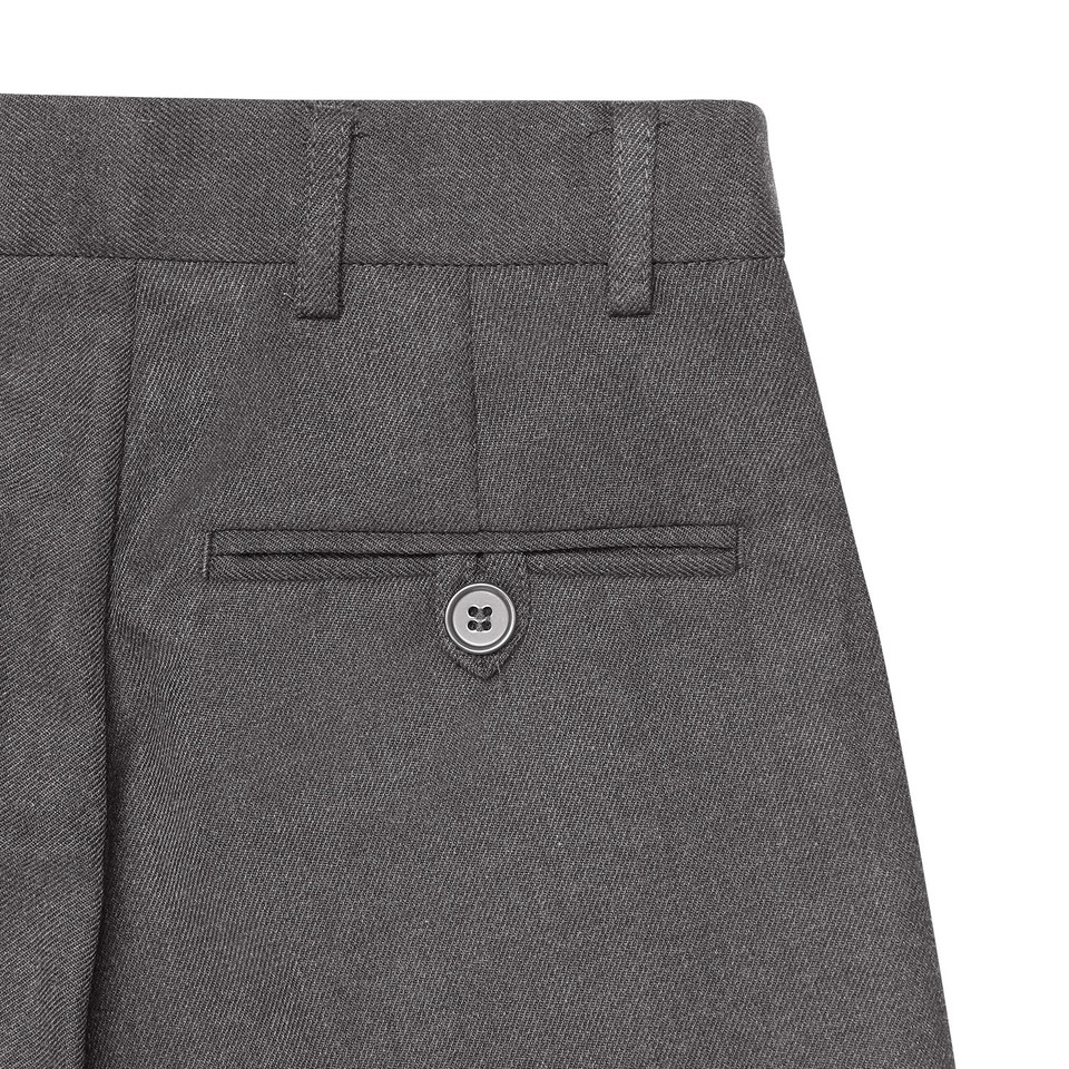 Mid-grey kids formal trousers rear detail showing welt pocket with button and twill weave fabric