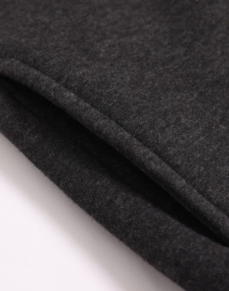 Charcoal marle half zip fleece sweater showing textured fabric detail and folded hem