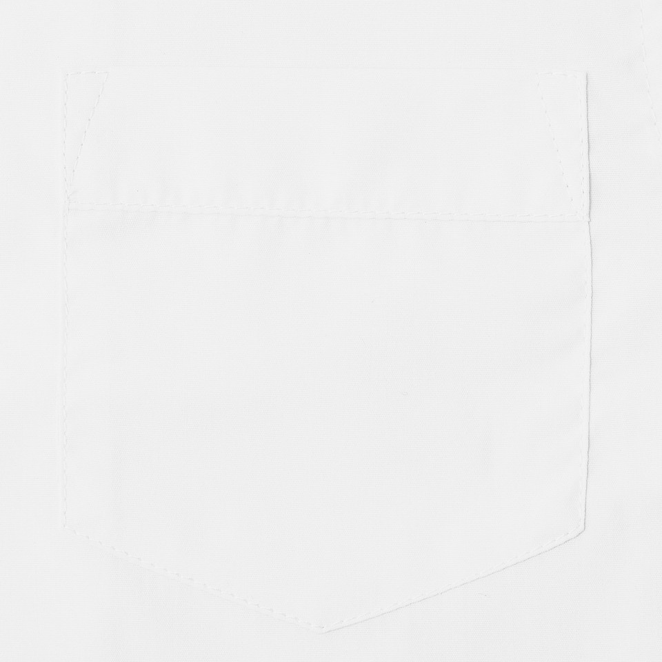 Close-up of white short sleeve school blouse chest pocket with clean stitched edges