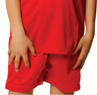 Bright red mesh basketball shorts with elastic waistband on child model