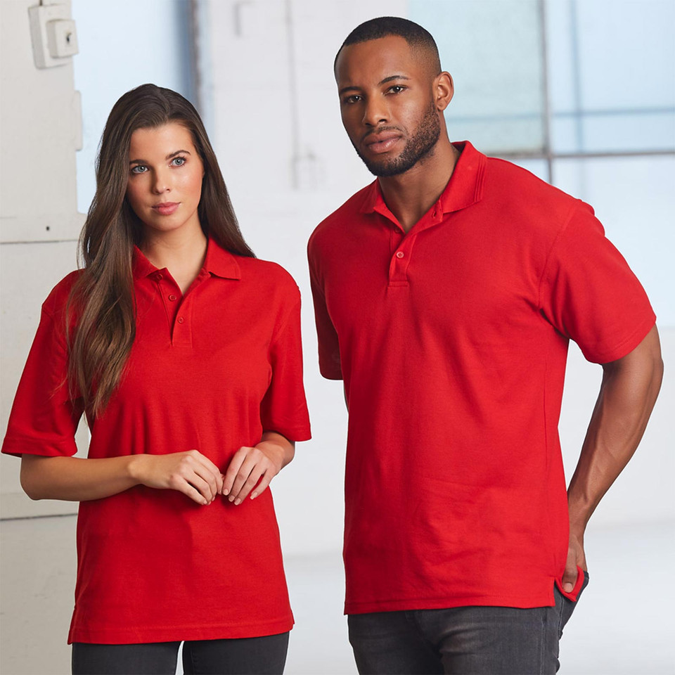 Man and woman wearing matching red pique polo shirts with ribbed collar and two-button placket