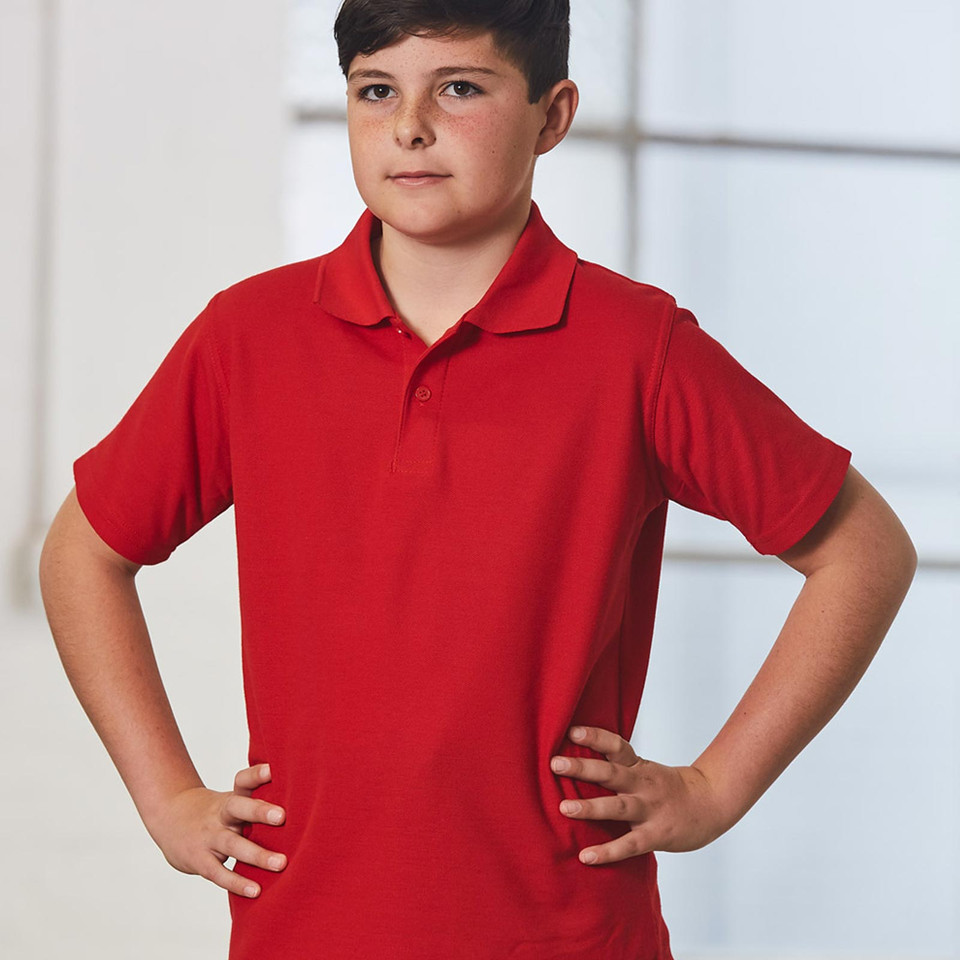 Bright red kids pique polo with classic collar and short sleeves on white background