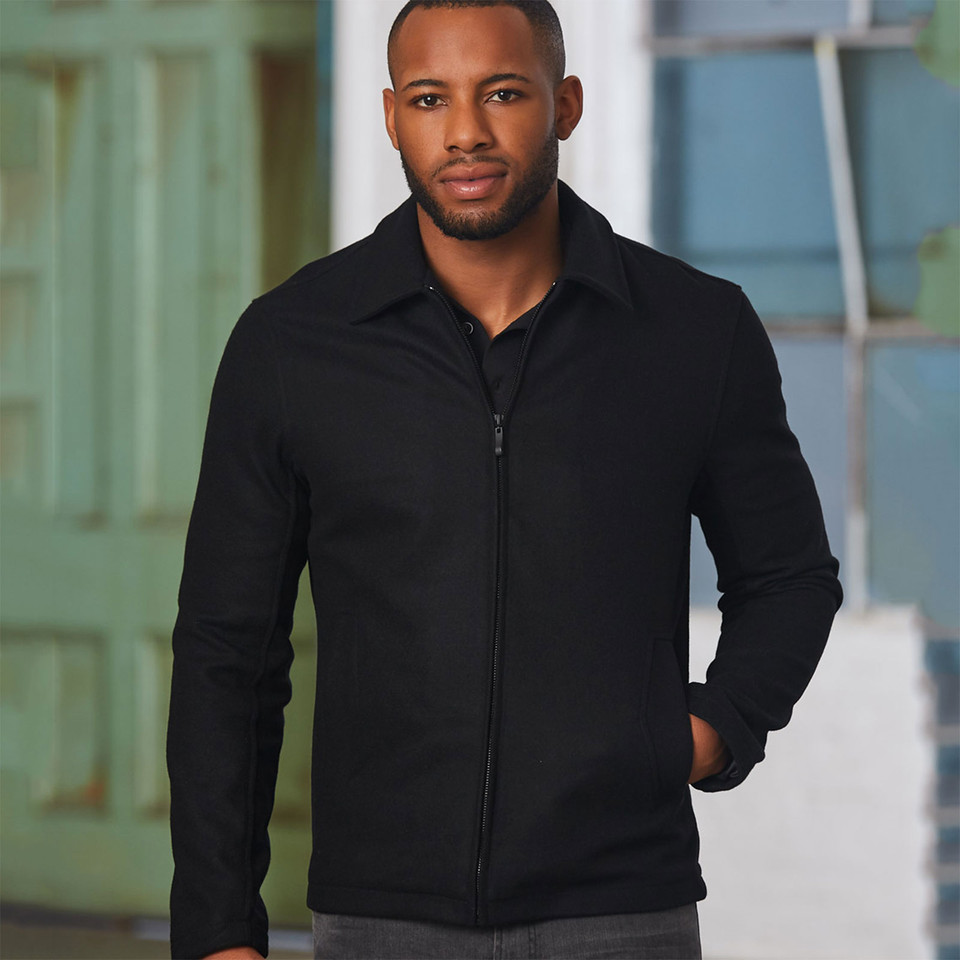 Man wearing a black wool blend full-zip jacket with spread collar and clean front panels