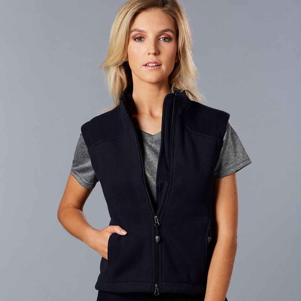 Black polar fleece vest with full front zipper and side pockets worn over grey tee