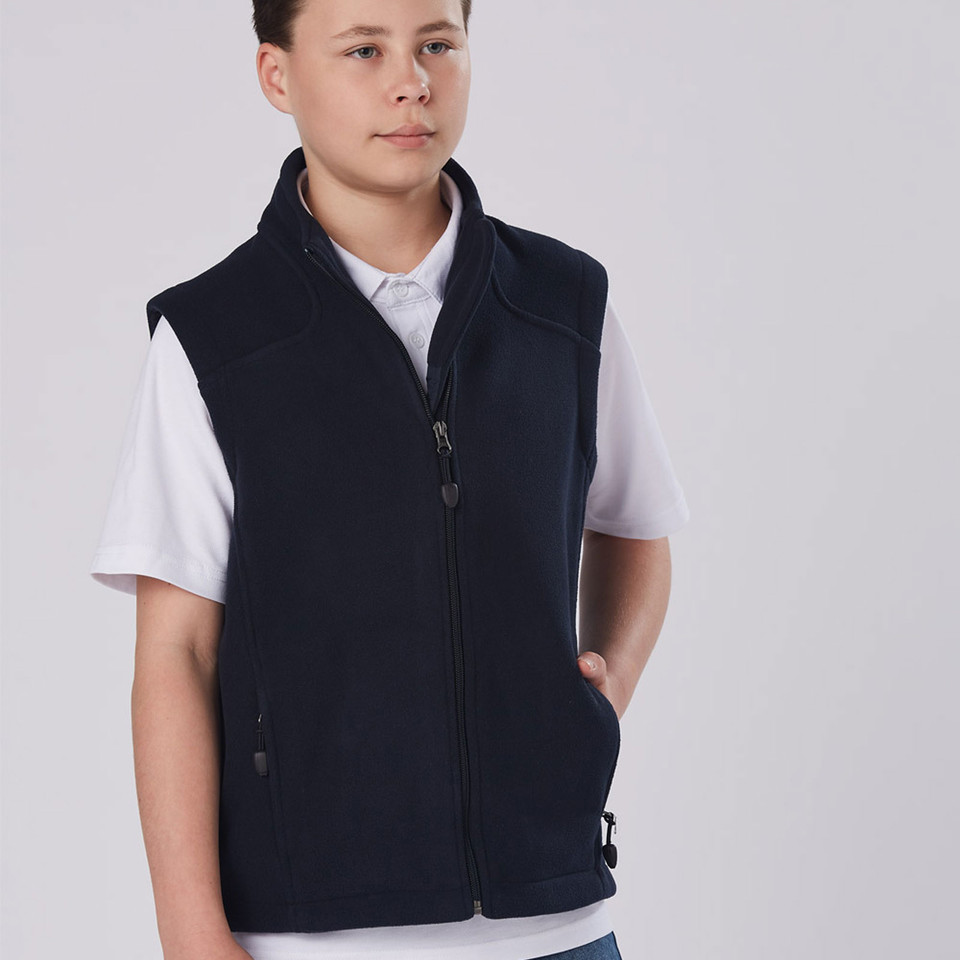 Navy polar fleece vest with full zip front and side pockets worn over white polo shirt