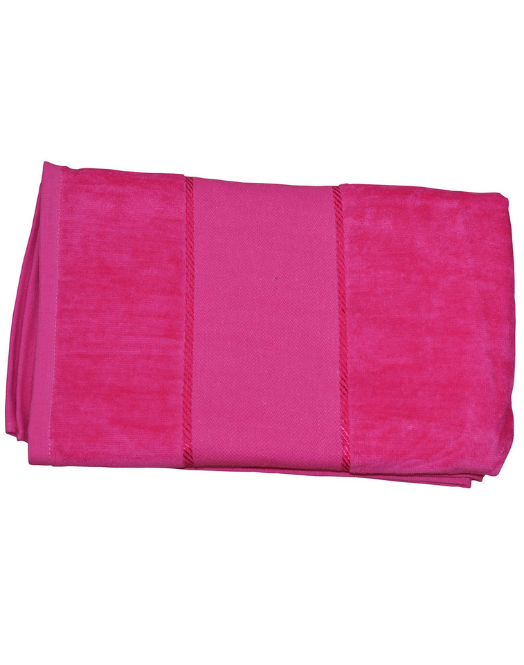 Hot pink cotton velour beach towel with central flat panel and textured border sections