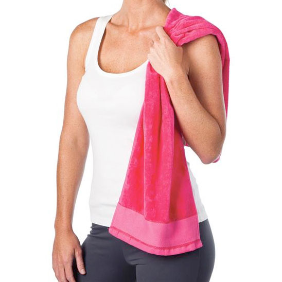 Hot pink fitness towel with lighter pink border stripe detail held over shoulder