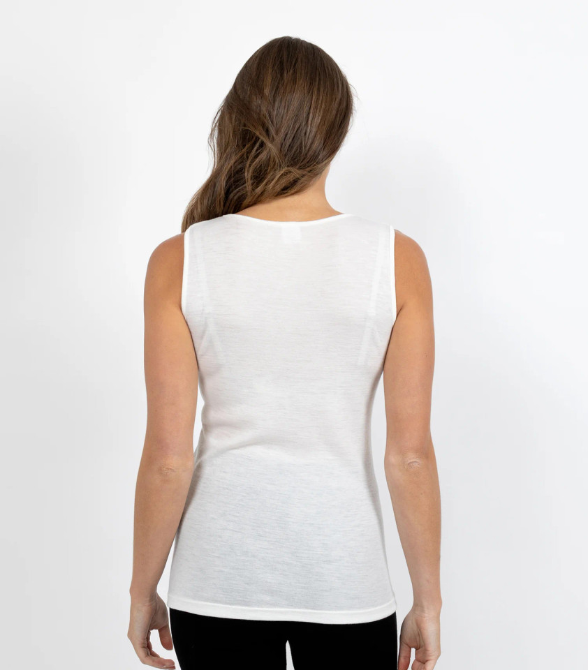 White merino wool sleeveless vest shown from back with classic crew neckline and ribbed hem detail