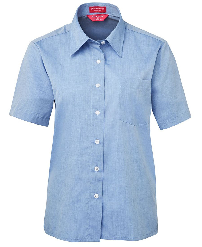 Ladies light blue chambray short sleeve shirt with point collar, white buttons, and chest pocket