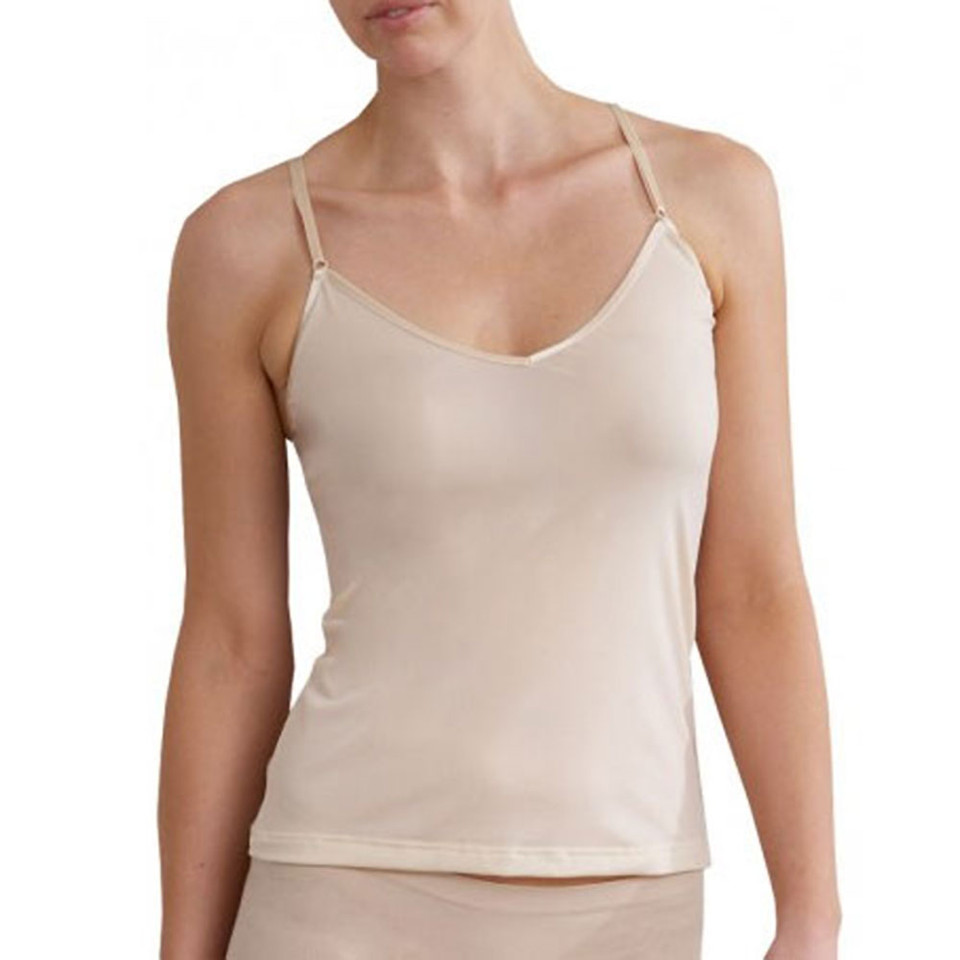 Woman wearing a nude smooth camisole with thin adjustable straps and V-neckline