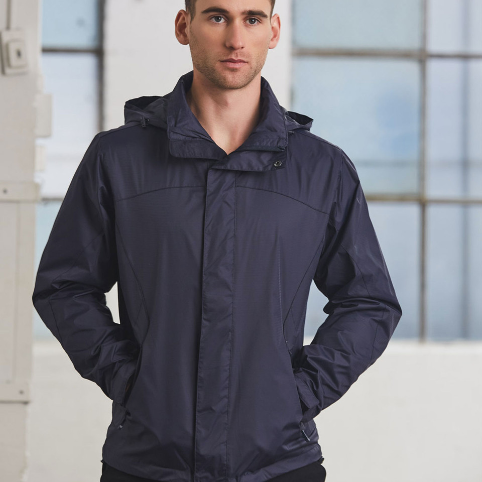 Navy jacket with concealed hood, storm flap closure, and shoulder panel detail