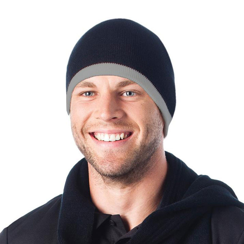 Man wearing navy knit beanie with grey contrast ribbed cuff, relaxed fit, no brim
