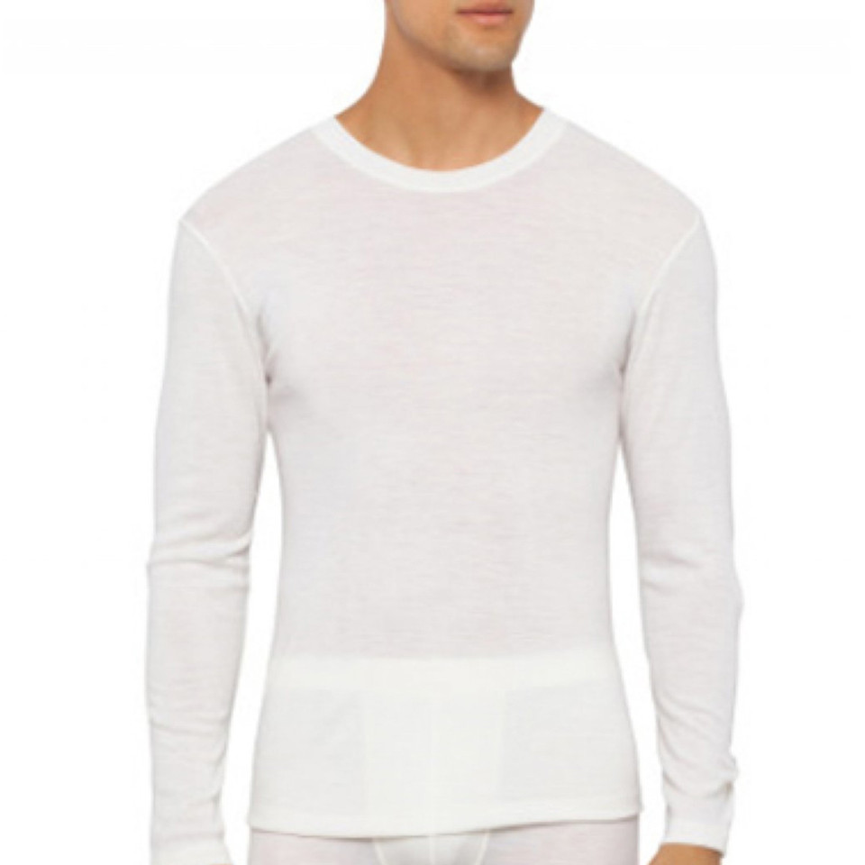 White pure merino wool thermal long sleeve top with crew neckline and ribbed cuffs
