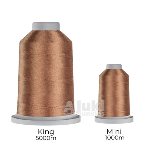 Close-up of two spools of Glide 40 weight polyester thread in Acorn: a large King spool (5,500 yards) and a smaller Mini spool (1,100 yards), shown side by side for size comparison, with a smooth texture and noticeable sheen.