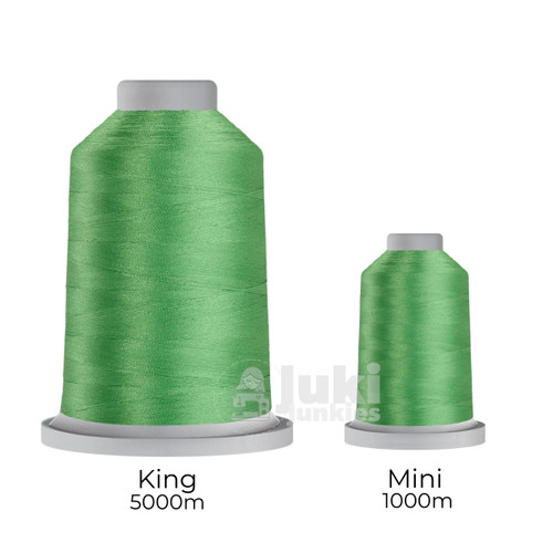 Close-up of two spools of Glide 40 weight polyester thread in Lime: a large King spool (5,500 yards) and a smaller Mini spool (1,100 yards), shown side by side for size comparison, with a smooth texture and noticeable sheen.