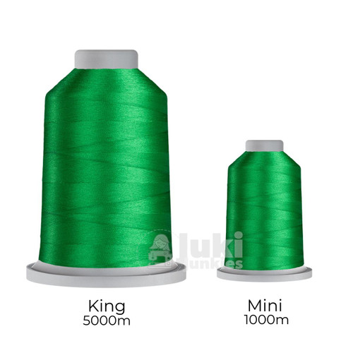Close-up of two spools of Glide 40 weight polyester thread in Melon: a large King spool (5,500 yards) and a smaller Mini spool (1,100 yards), shown side by side for size comparison, with a smooth texture and noticeable sheen.