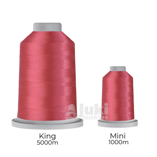 Close-up of two spools of Glide 40 weight polyester thread in Bloom: a large King spool (5,500 yards) and a smaller Mini spool (1,100 yards), shown side by side for size comparison, with a smooth texture and noticeable sheen.