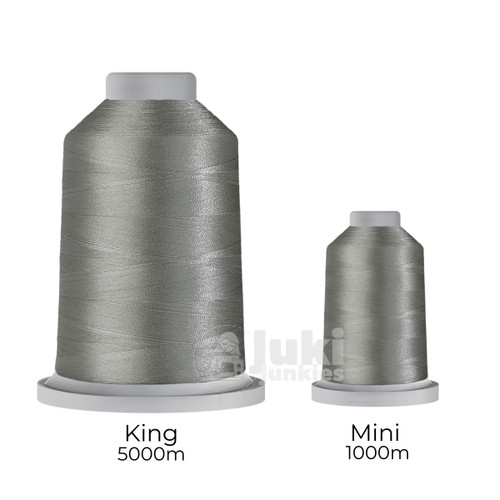 Close-up of two spools of Glide 40 weight polyester thread in Stargazer: a large King spool (5,500 yards) and a smaller Mini spool (1,100 yards), shown side by side for size comparison, with a smooth texture and noticeable sheen.