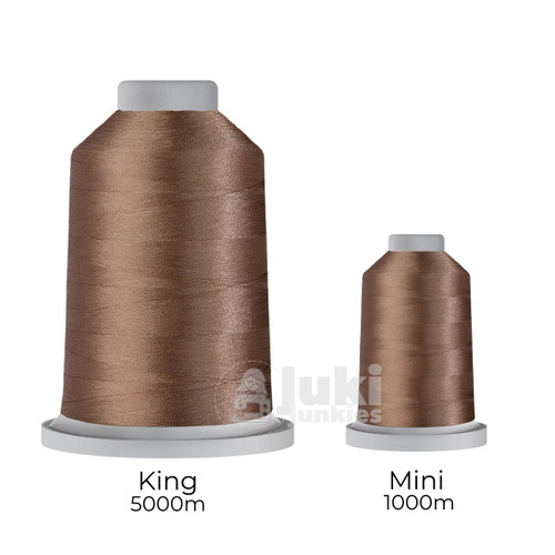 Close-up of two spools of Glide 40 weight polyester thread in Pewter: a large King spool (5,500 yards) and a smaller Mini spool (1,100 yards), shown side by side for size comparison, with a smooth texture and noticeable sheen.