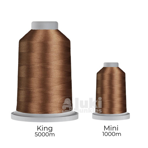 Close-up of two spools of Glide 40 weight polyester thread in Suede: a large King spool (5,500 yards) and a smaller Mini spool (1,100 yards), shown side by side for size comparison, with a smooth texture and noticeable sheen.