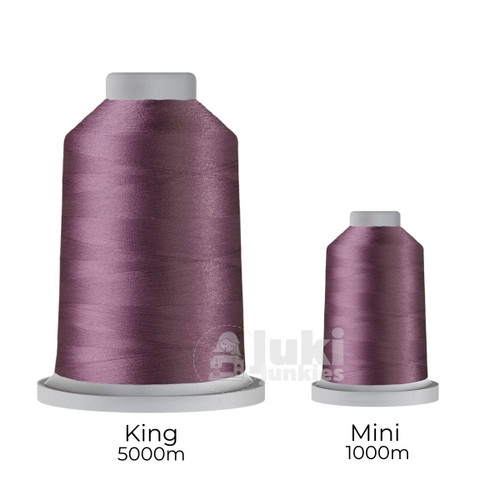 Close-up of two spools of Glide 40 weight polyester thread in Thistle: a large King spool (5,500 yards) and a smaller Mini spool (1,100 yards), shown side by side for size comparison, with a smooth texture and noticeable sheen.