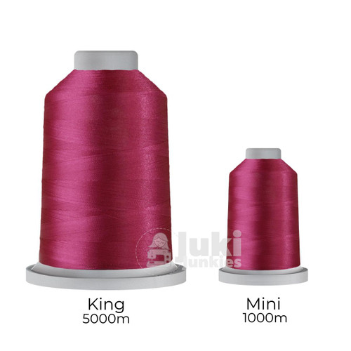 Close-up of two spools of Glide 40 weight polyester thread in Pomegranate: a large King spool (5,500 yards) and a smaller Mini spool (1,100 yards), shown side by side for size comparison, with a smooth texture and noticeable sheen.