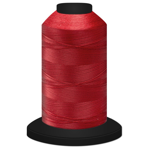 Close-up of a 5,500-yard spool tightly wound with Candy Apple Glide 60 weight polyester thread, showing its fine, smooth texture and slight sheen.