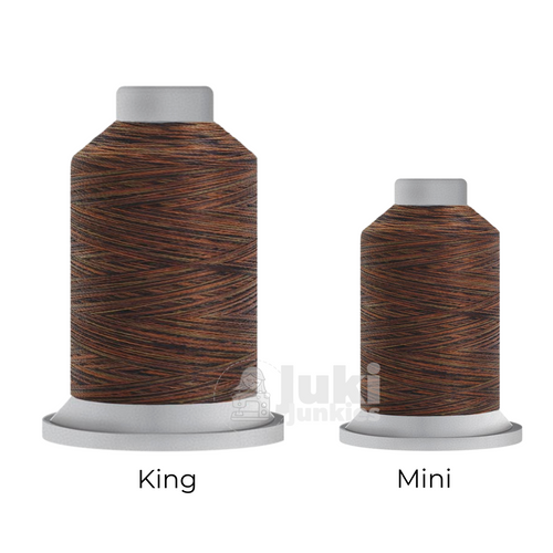 Close-up of two Affinity 40 weight variegated polyester thread spools in shades of orange, beige, and brown, highlighting the gradual color transitions. A large King spool (3,000 yards) and a smaller Mini spool (1,000 yards) are side by side for size comparison.