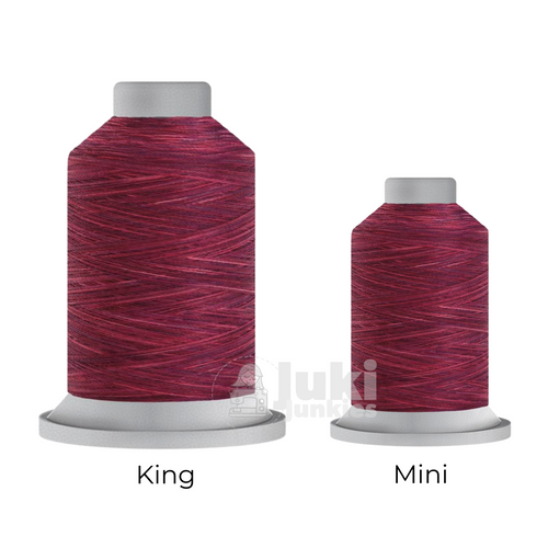 Close-up of two Affinity 40 weight variegated polyester thread spools in shades of magenta and pink, highlighting the gradual color transitions. A large King spool (3,000 yards) and a smaller Mini spool (1,000 yards) are side by side for size comparison.