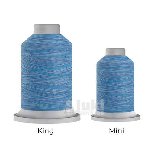 Close-up of two Affinity 40 weight variegated polyester thread spools in shades of blue and white, highlighting the gradual color transitions. A large King spool (3,000 yards) and a smaller Mini spool (1,000 yards) are side by side for size comparison.