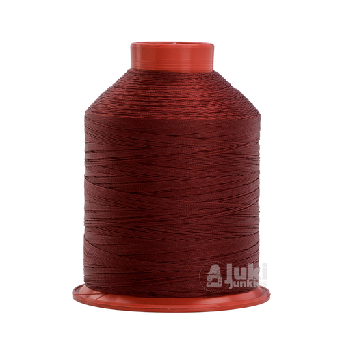 Close-up of a 1,500-yard spool of bonded nylon Tex 70 thread in Crimson, showing its smooth, slightly glossy finish.