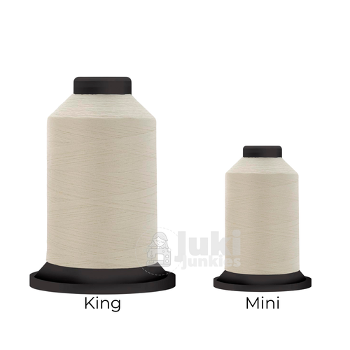 Close-up of two Premo-Soft 50 weight polyester thread spools in Cream, showing a soft, matte texture. A large King spool (3,000 yards) and a smaller Mini spool (670 yards) are side by side for size comparison.