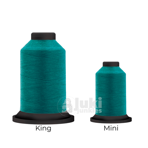 Close-up of two Premo-Soft 50 weight polyester thread spools in Aqua, showing a soft, matte texture. A large King spool (3,000 yards) and a smaller Mini spool (670 yards) are side by side for size comparison.